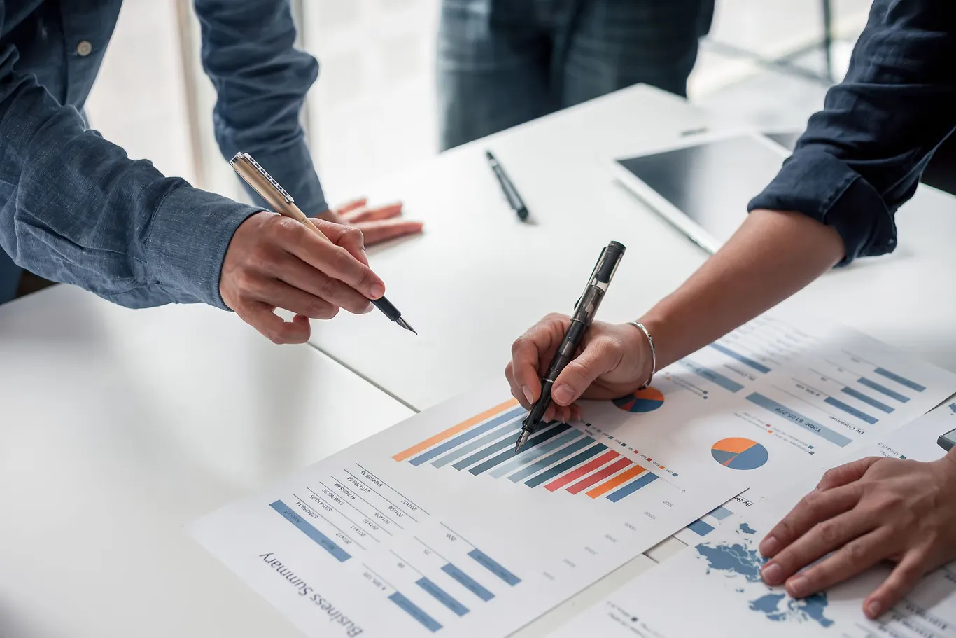 Advisers discussing financial findings in a meeting